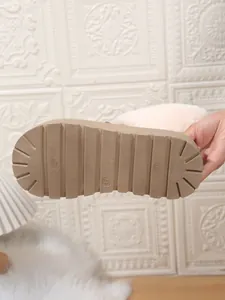 Detailed view of the anti-slip thick outsole of a women's warm winter snow boot