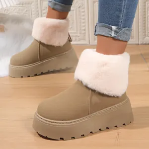 Detail of warm khaki snow boots with plush faux fur trim and thick platform sole.