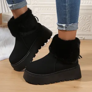 Stylish women's black platform snow boots with thick faux fur trim for winter warmth