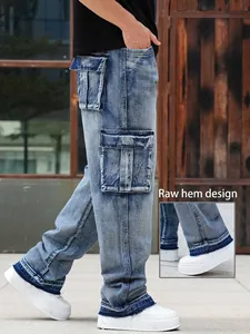 Detail shot showing the frayed raw hem design on men's blue washed loose cargo jeans
