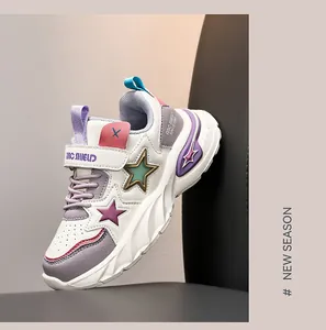 Detailed view of kids' fashion sneakers featuring star patterns and durable rubber soles