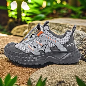 Grey children's closed-toe sports sandals with breathable mesh and anti-slip sole.