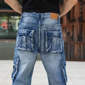 Detailed back view of men's loose blue denim cargo pants with multiple flap pockets