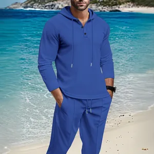 Blue waffle-knit men's leisure set featuring a hooded long-sleeve top and matching pants