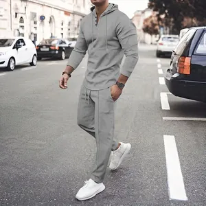 High-quality detail of men's grey waffle knit casual hoodie and pants tracksuit set