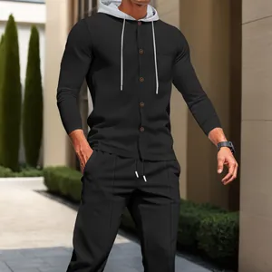 Detailed view of men's black waffle knit tracksuit set featuring a grey hooded cardigan.
