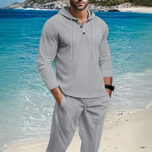 Detail view of a men's grey waffle knit hooded tracksuit set for outdoor casual wear