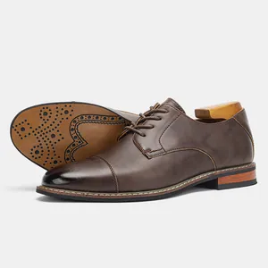 Classic men's brown cap toe dress shoes with elegant side profile and decorative sole detail