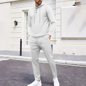 Macro detail of men's white waffle knit tracksuit set with hooded sweatshirt and pants