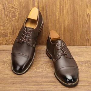 Close-up of polished brown leather men's dress shoes showing fine stitching detail