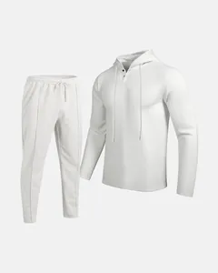 Close-up of men's white waffle knit tracksuit set with hooded top and drawstring pants.