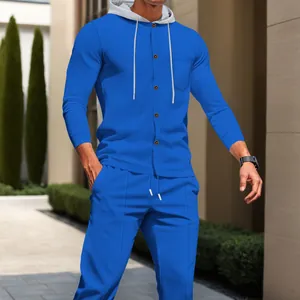 Detailed view of men's blue waffle knit tracksuit with buttoned hooded jacket and pants