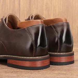 Detail view of the polished brown heel and textured sole of classic men's dress shoes