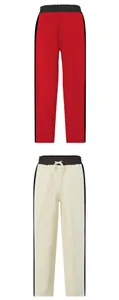 Detail view showing men's premium heavy cotton sweatpants in red and off-white