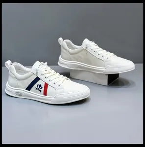 Detailed close-up view of white men's leather sneakers featuring tricolor stripe detail