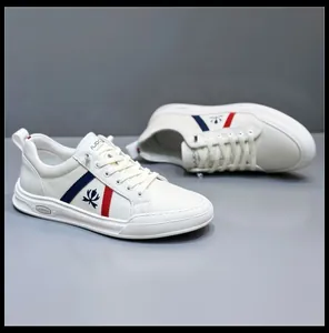 Stylish white leather men's sneakers with blue and red side stripes and logo detail