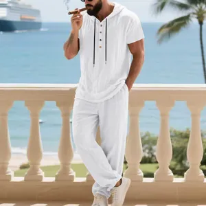 Men's white linen hooded Henley short sleeve shirt and trousers set in resort style