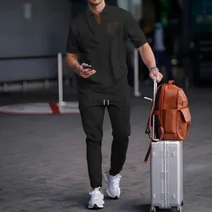 Two-piece men's waffle knit polo and joggers set in dark grey for casual travel