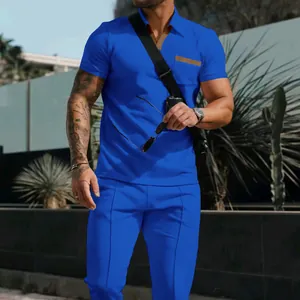 Men's royal blue waffle knit summer set with short sleeve polo shirt and long trousers.