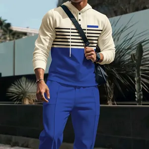 Men's waffle knit hooded sweatshirt and pants set with stylish color block design.