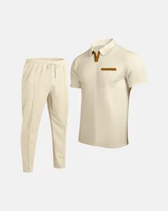 Full view of men's cream waffle knit polo shirt and matching drawstring pants set