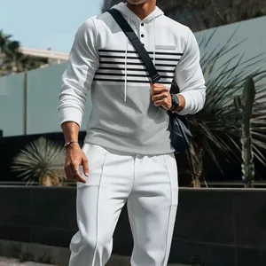 Stylish men's waffle knit color-block hoodie and matching trousers set with stripes