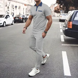 Graues Waffelstrick Polo- und Jogging-Set für Herren mit blauem Kontrastkragen
