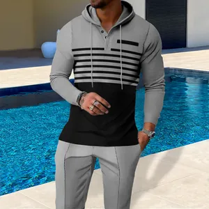 Detail view of men's grey and black color block waffle knit hoodie and pants set