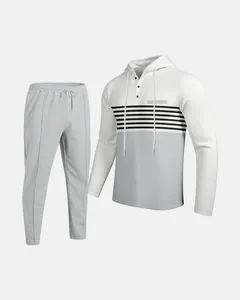 Detailed view of men's color block waffle knit hoodie and joggers set in grey and white