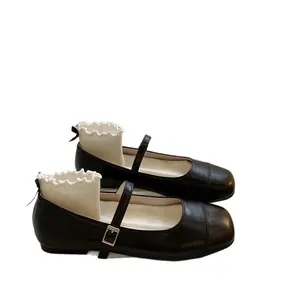 Chaussures babies élégantes en cuir noir pour filles avec bout carré et bride réglable