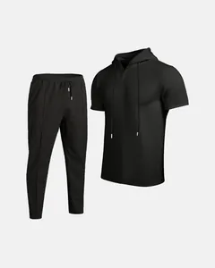 Detail view of men's black waffle knit hooded top and pants two-piece set