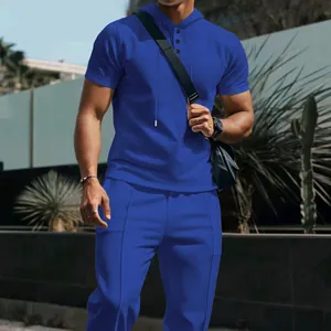 Men's blue waffle knit two-piece set with hooded polo shirt and matching trousers
