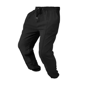 Detail view of black waffle knit texture on men's loose fit casual athletic pants.
