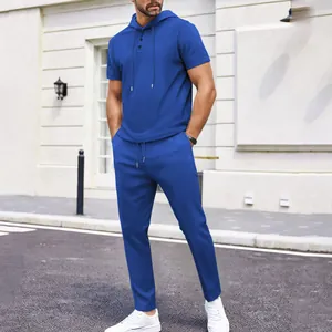 Full view of the royal blue waffle knit men's set featuring a hooded top and long pants.