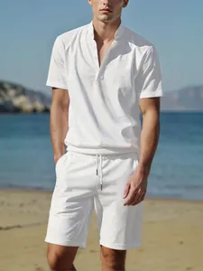 Casual men's white linen Henley shirt and drawstring shorts set for summer beach wear.