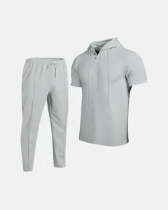 Detailed texture of light gray men's waffle knit short-sleeve hoodie and pants set
