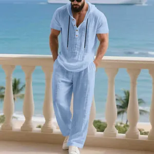 Men's light blue linen-like 2-piece hooded Henley shirt and pants set for beach leisure.
