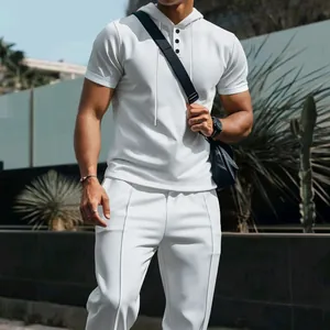 Close-up detail of a white waffle knit short-sleeve hoodie and matching pants set