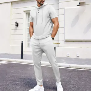 Casual white waffle knit texture hooded top and pants two-piece set for men lifestyle view