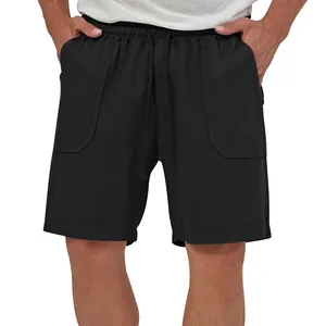 Detail of men's black cotton-linen shorts with elastic drawstring waist and side pockets