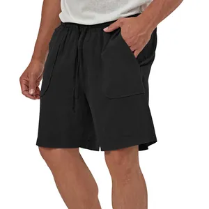 Detailed view of men's casual black cotton linen shorts with elastic drawstring waistband.
