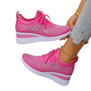 Breathable pink mesh sneakers for women featuring sparkling rhinestone accents.