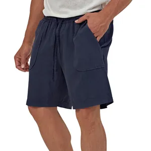 Detail view of men's navy blue loose cotton linen casual shorts with drawstring waist and pockets