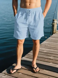 Pantalones cortos de lino azul claro para hombre, transpirables para playa de verano.