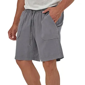 Detail shot of grey cotton linen casual shorts with drawstring and side pockets.