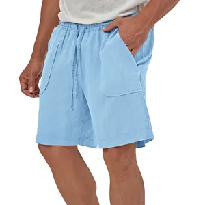 Detail of men's light blue cotton linen shorts featuring breathable fabric texture.