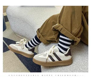 Retro white German Army Trainer sneakers for kids with durable brown rubber sole
