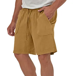 Close-up of men's mustard yellow cotton linen shorts with drawstring waist and pockets