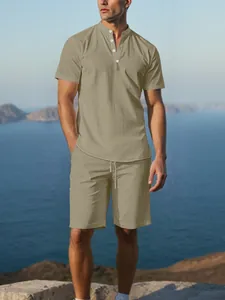 Detail view of men's beige cotton linen short-sleeved Henley shirt and matching shorts