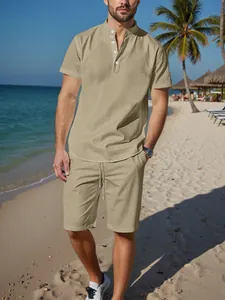 Men's khaki linen short-sleeve Henley shirt and shorts set worn on a sunny beach